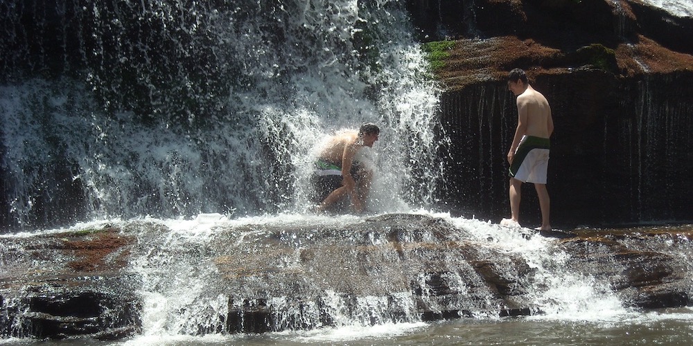 Keeping Cool At A Waterfall In A Hot Summer
