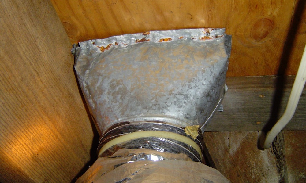 Uninsulated duct boot in a vented crawl space - a recipe for condensatin and moisture damage