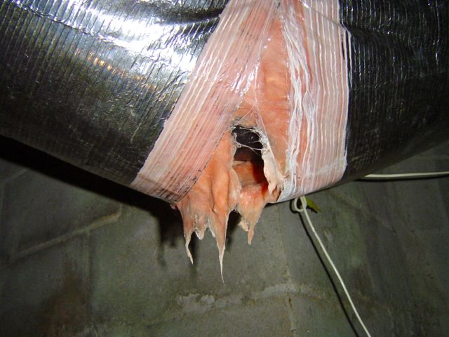 Flex duct jacket and insulation blowout caused by the weight of boot condensation collected in a low spot
