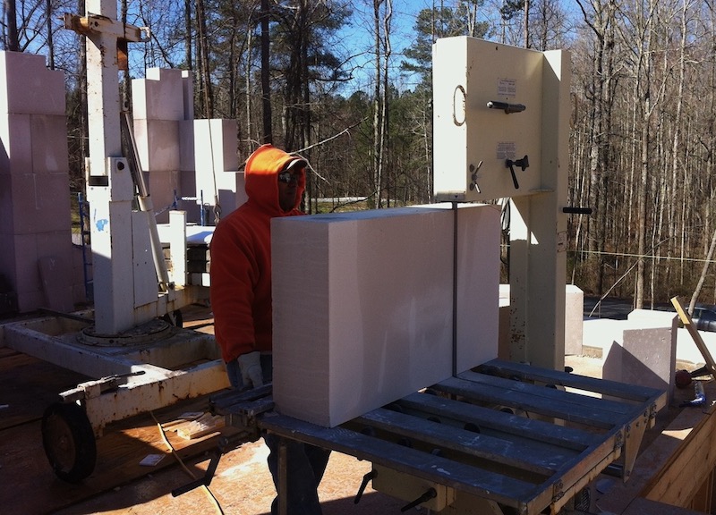 Sawing an aerated autoclaved concrete (AAC) block at a new home construction site in the Serenbe community