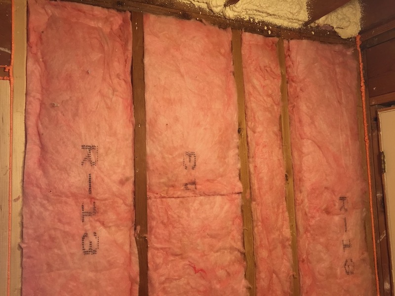 Grade 1 fiberglass batt insulation in an exterior wall