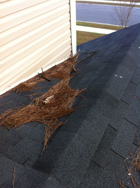 A design flaw that can result in water damage at a roof-wall intersection