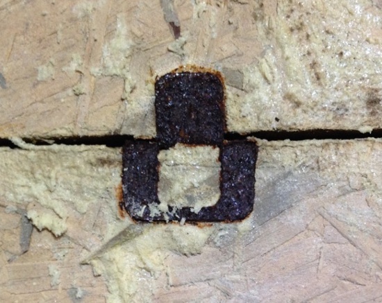 This rusty OSB clip shows the effects of moisture at the roof deck