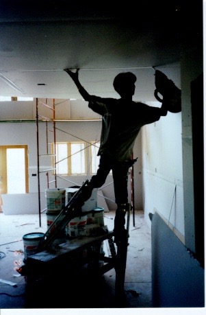 Drywall-finisher-on-stilts.jpg