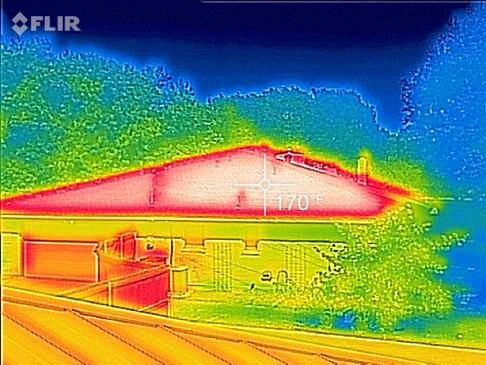 An infrared image of a hot, dark roof