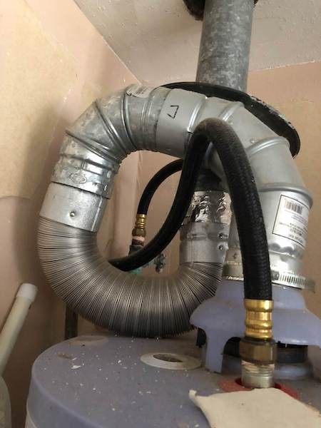 Natural draft gas water heater dangerous flue