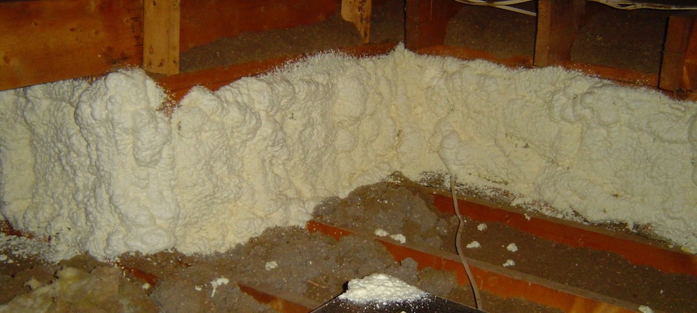 The same short attic kneewall, after insulating and air sealing with fiberglass batts and closed-cell spray foam