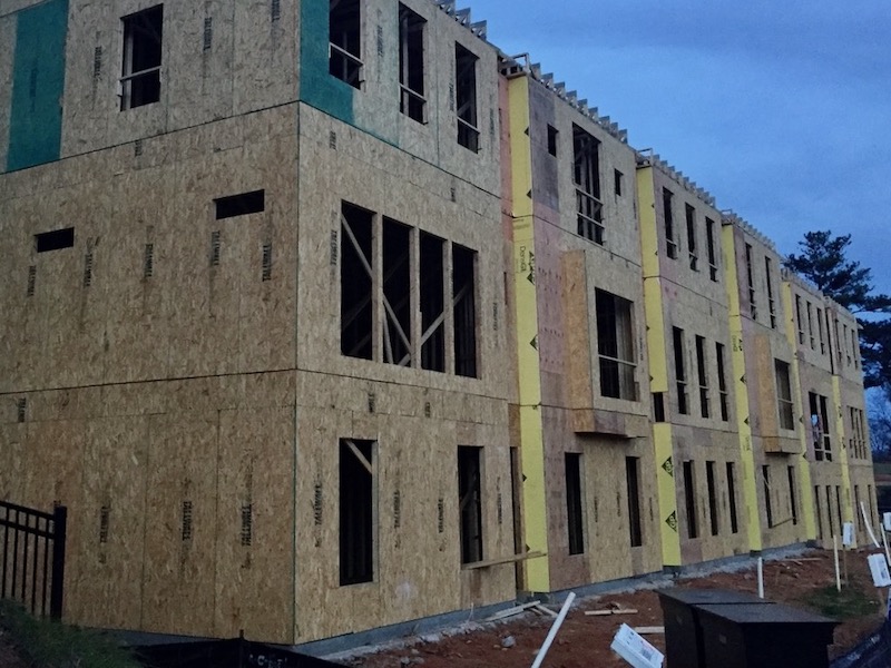 Traditional multifamily housing sheathed with OSB, plywood, and gypsum board