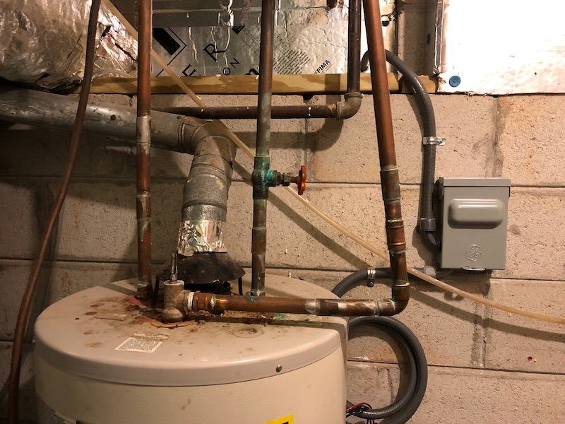 Gas natural draft water heater, replaced by a heat pump water heater