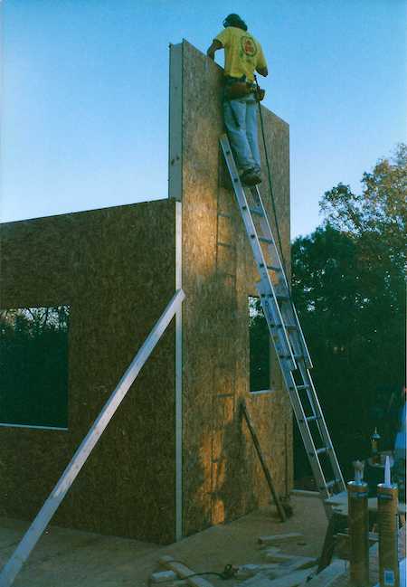 Building the first floor walls with structural insulated panels