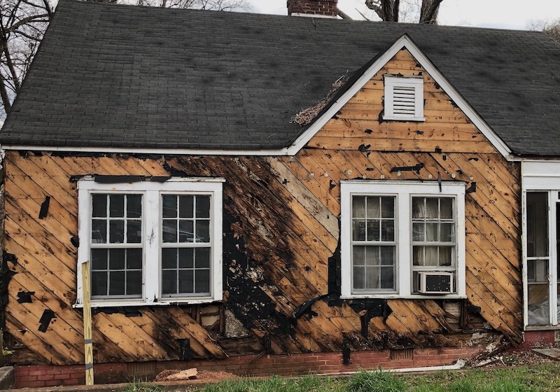 The lack of overhangs along with poor water management led to significant damage in this house 