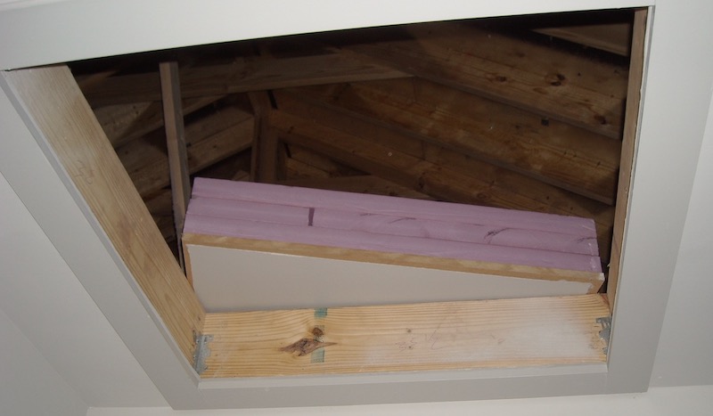 Air sealing an attic access scuttle hole