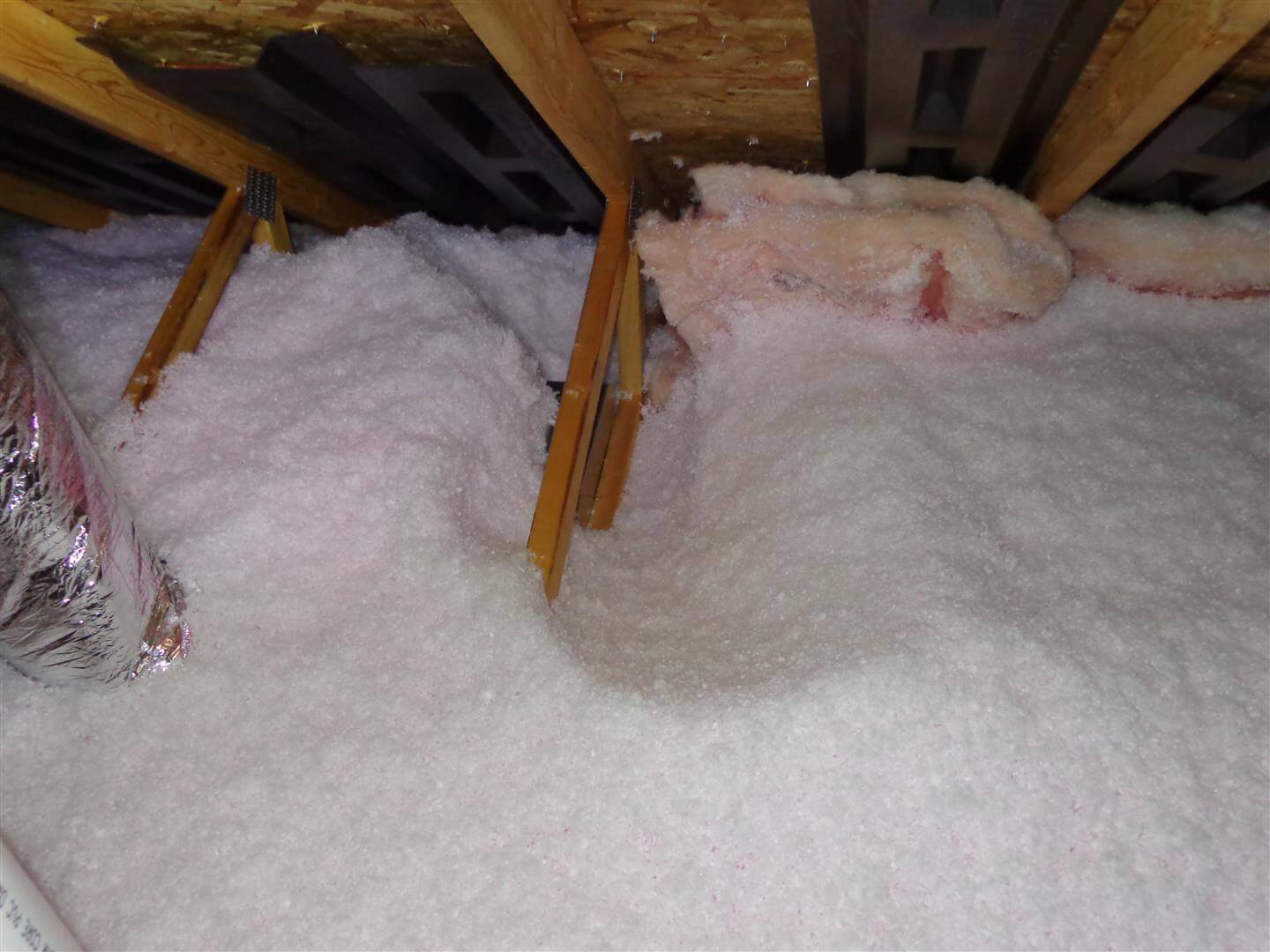 Wind washing of blown insulation in an attic can leave some areas completely uninsulated