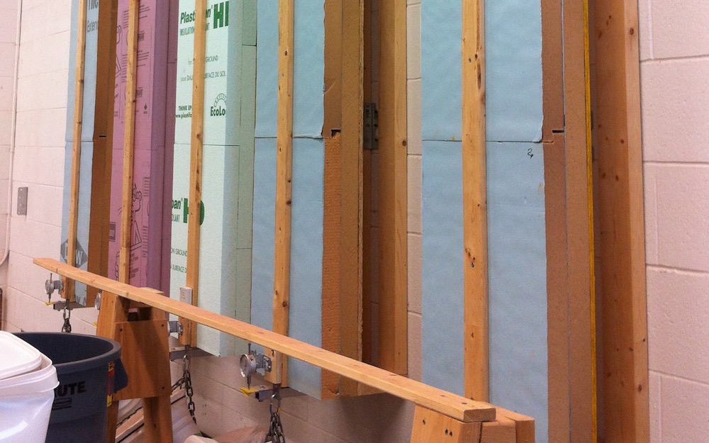 Rigid foam insulation being tested for attachment with long screws