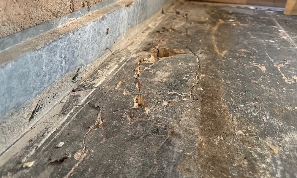 Cracks along the edge of my basement slab allow soil gases like radon to get into the home's air