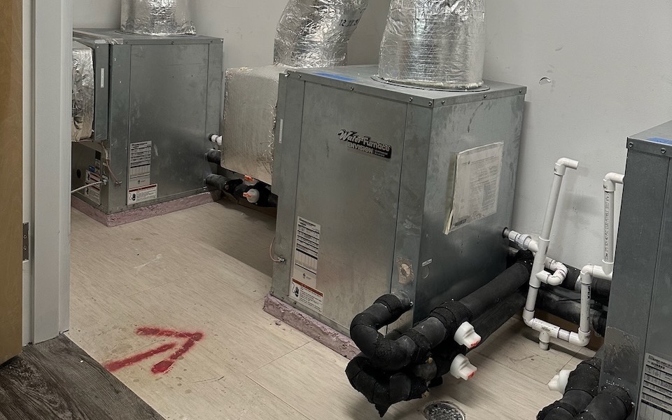 Ground source heat pumps in a net zero energy apartment building