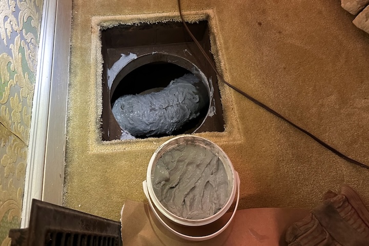 Before sealing the hole, Mike used mastic to encapsulate the asbestos tape on the duct below 