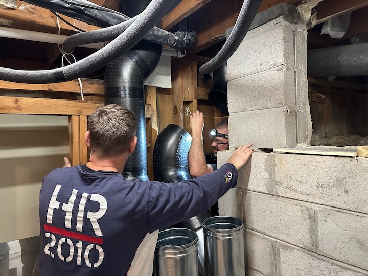 We began the second day by getting the ducts connected to the ERV in the basement and ready for the manifolds in the attic