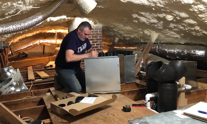 John Rockwell assembling a manifold in the attic
